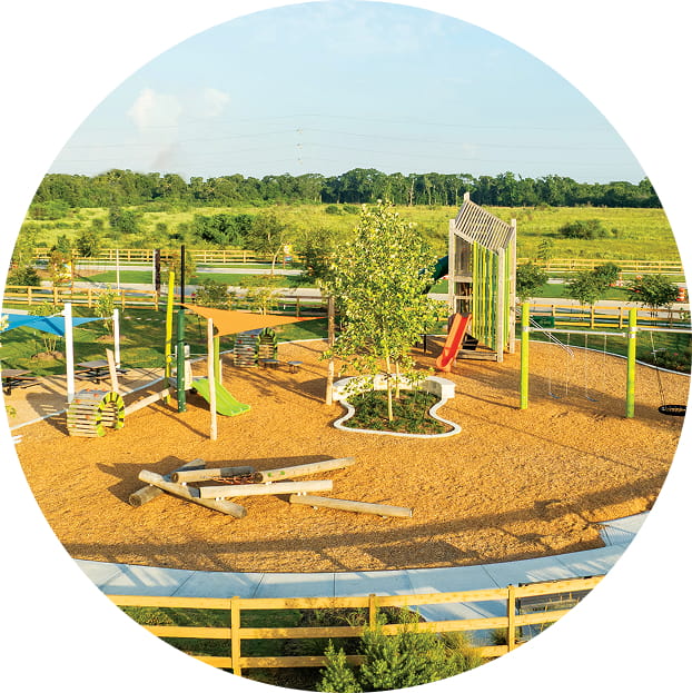Playground with trees and greenspaces amenities Creekhaven New Home Community in Iowa Colony, TX