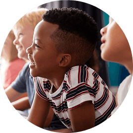 Young boy smiling at school