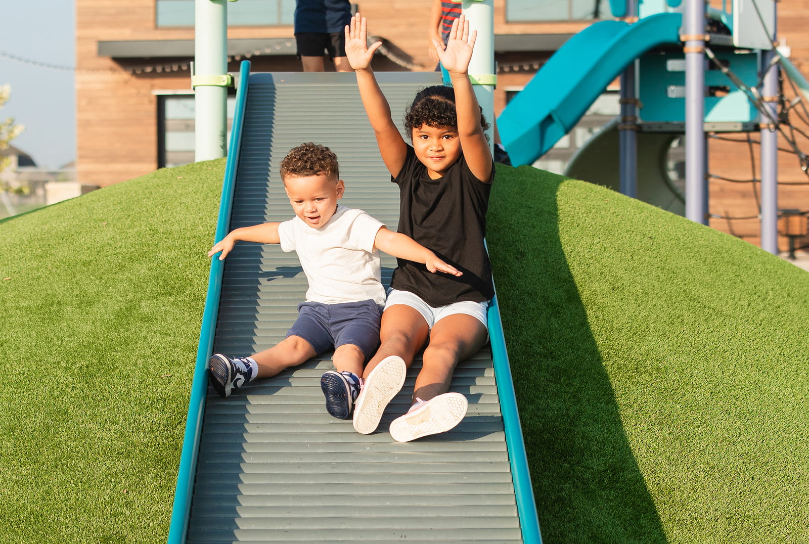 Creekhaven's Amenities in Iowa Colony Kids on Slide
