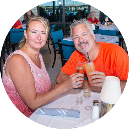 Couple enjoying drinks and a meal